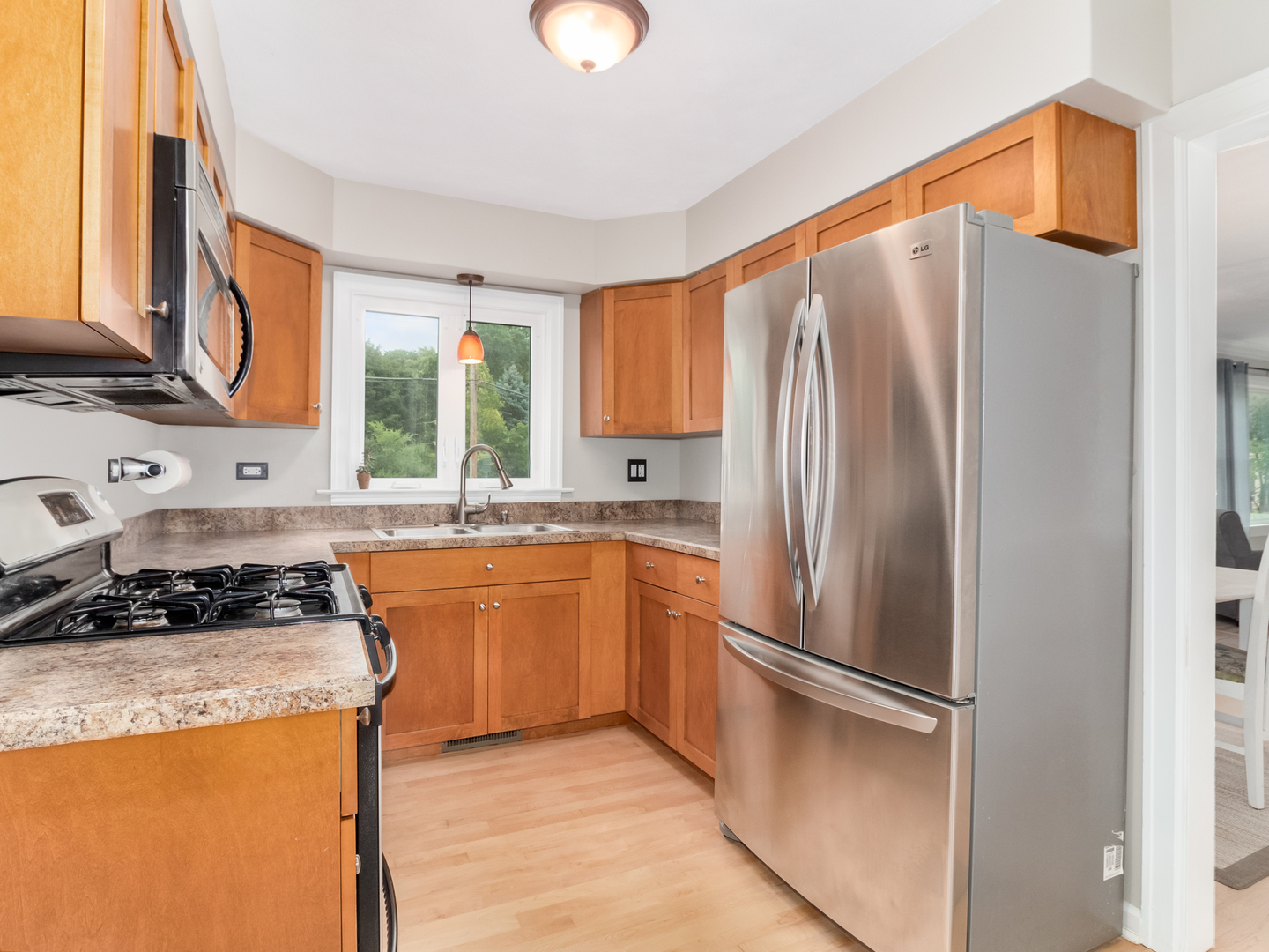 810 North Gary Avenue Wheaton, IL 60187 - Photo 16 of 36 a kitchen with stainless steel appliances granite countertop a refrigerator stove and sink