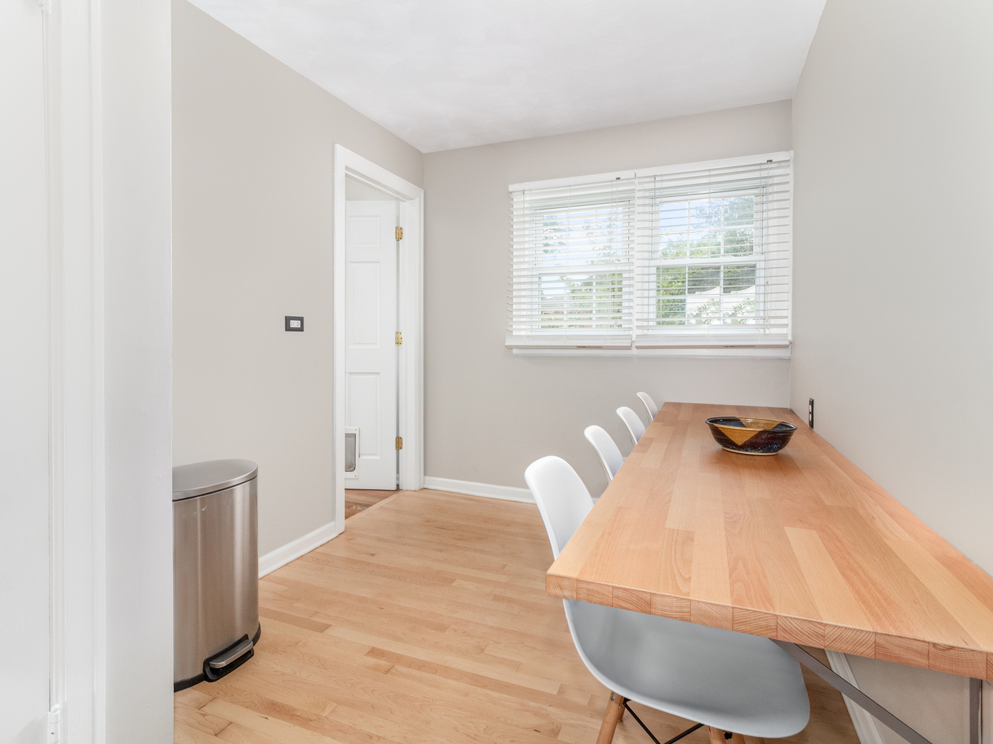 810 North Gary Avenue Wheaton, IL 60187 - Photo 18 of 36 a view of a dining room with furniture and wooden floor
