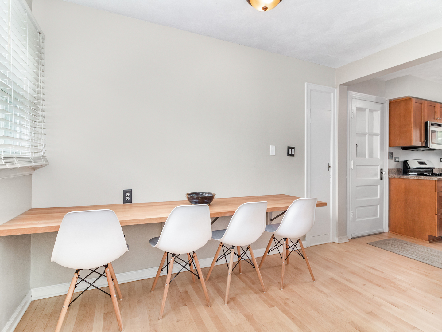 810 North Gary Avenue Wheaton, IL 60187 - Photo 19 of 36 a view of a dining room with furniture and wooden floor