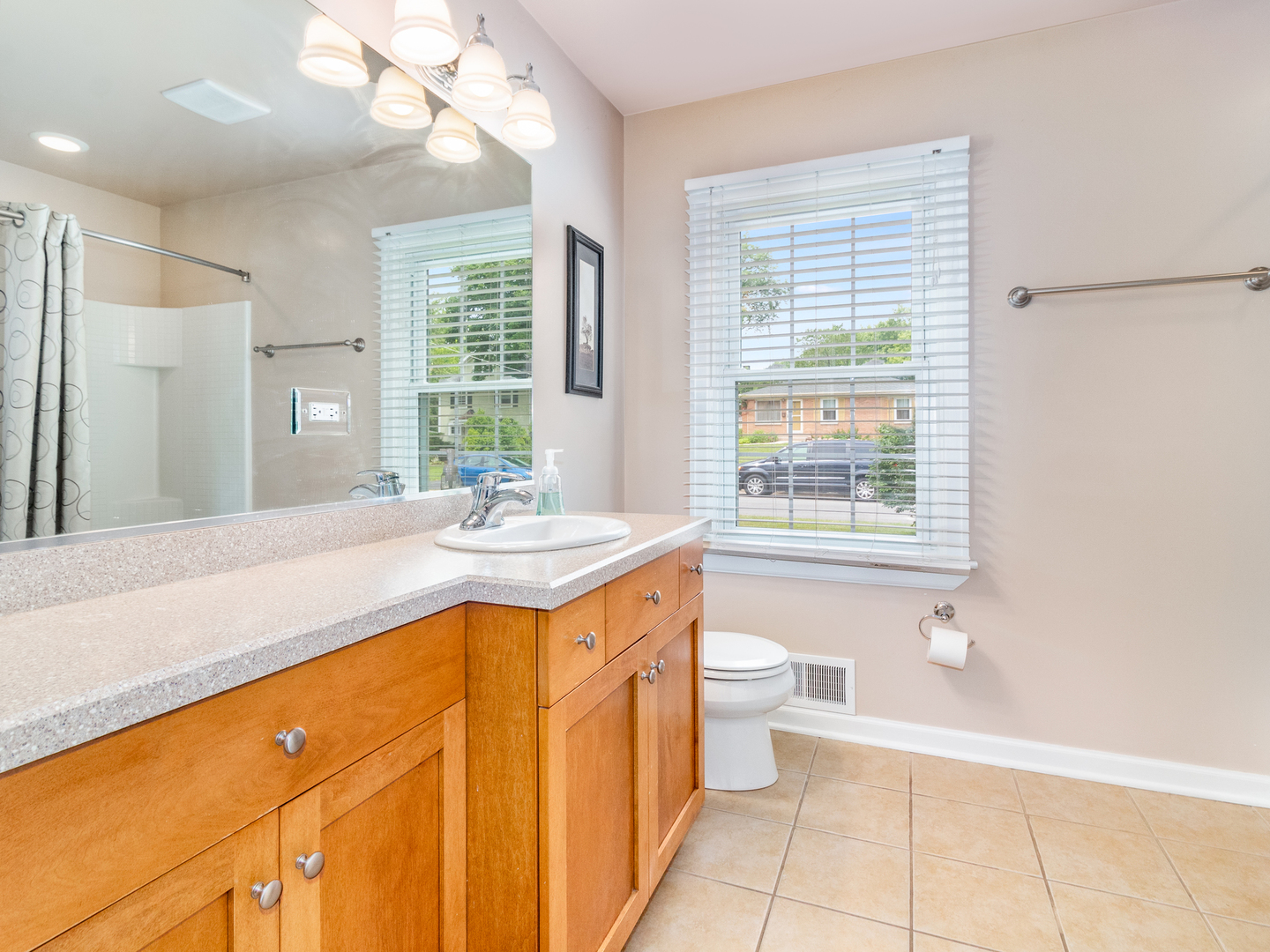 810 North Gary Avenue Wheaton, IL 60187 - Photo 21 of 36 a spacious bathroom with a granite countertop sink a toilet and a bathtub