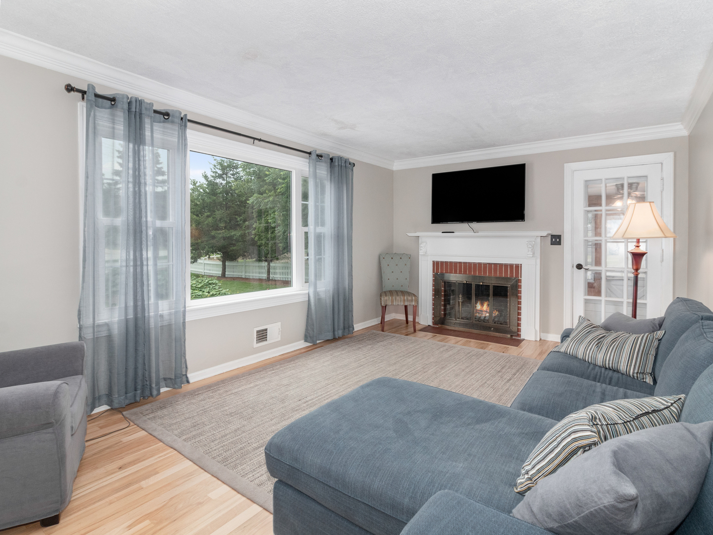 810 North Gary Avenue Wheaton, IL 60187 - Photo 10 of 36 a living room with furniture a flat screen tv and a fireplace