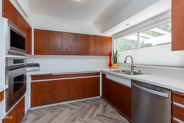 a view of kitchen with wooden floor