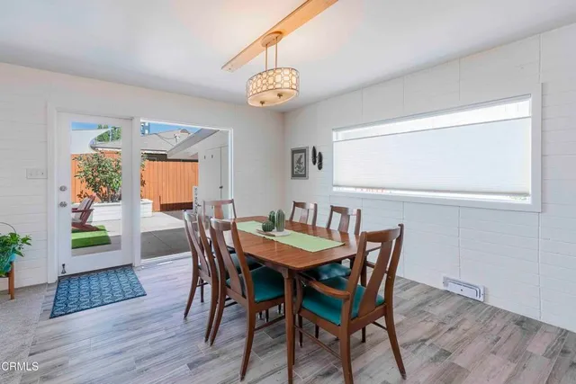 a living room with furniture and a lamp