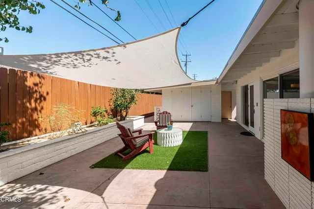 a view of a terrace with sitting area