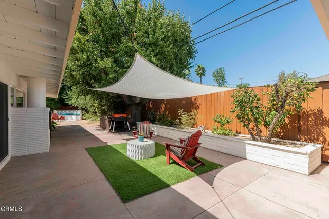 a view of a chairs and tables in the patio