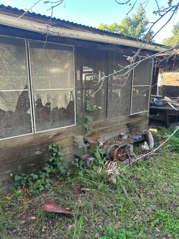 a view of a swimming pool with an outdoor space and seating area