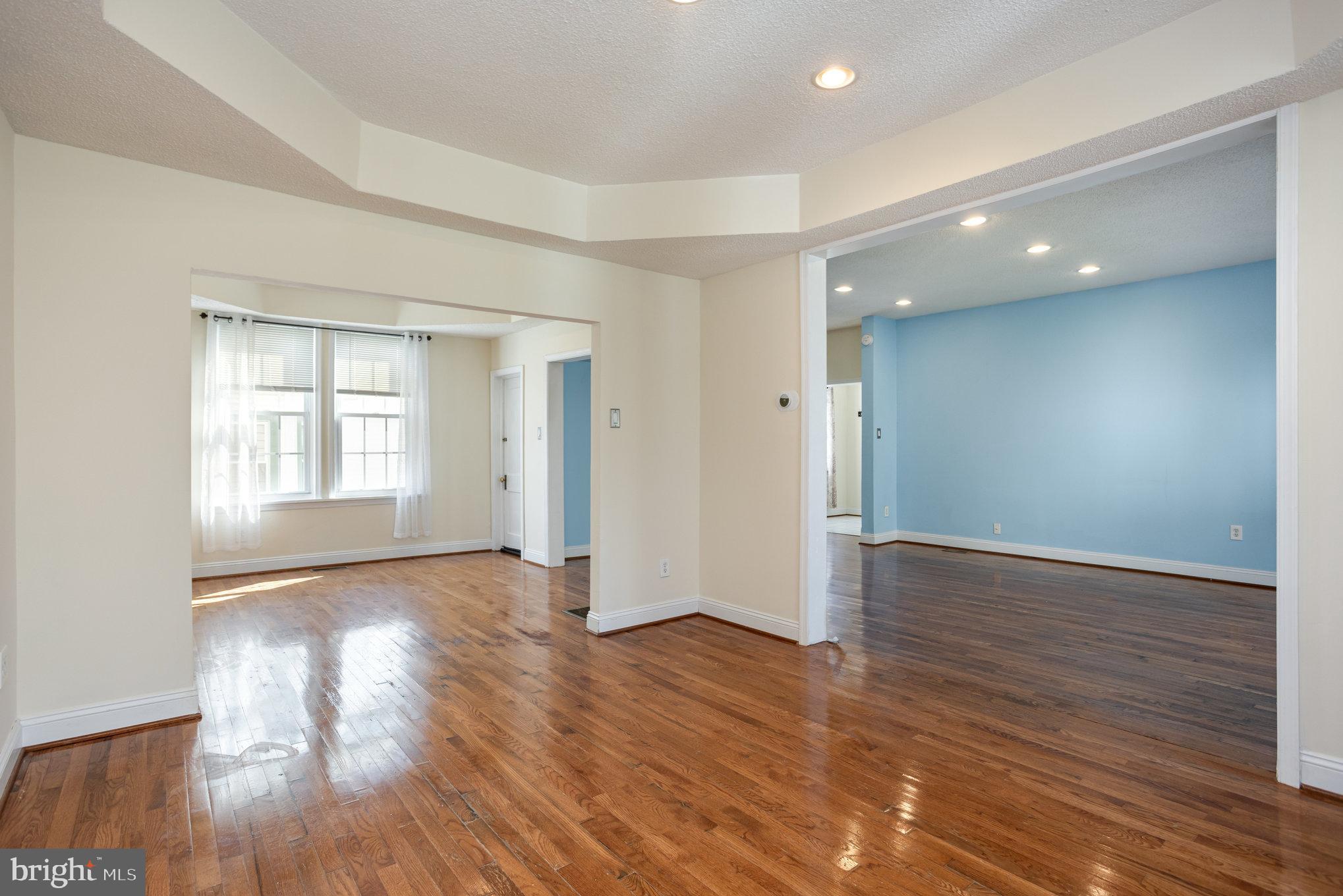 505 47th Street Baltimore, MD 21224 - Photo 14 of 41 a view of empty room with wooden floor and fan