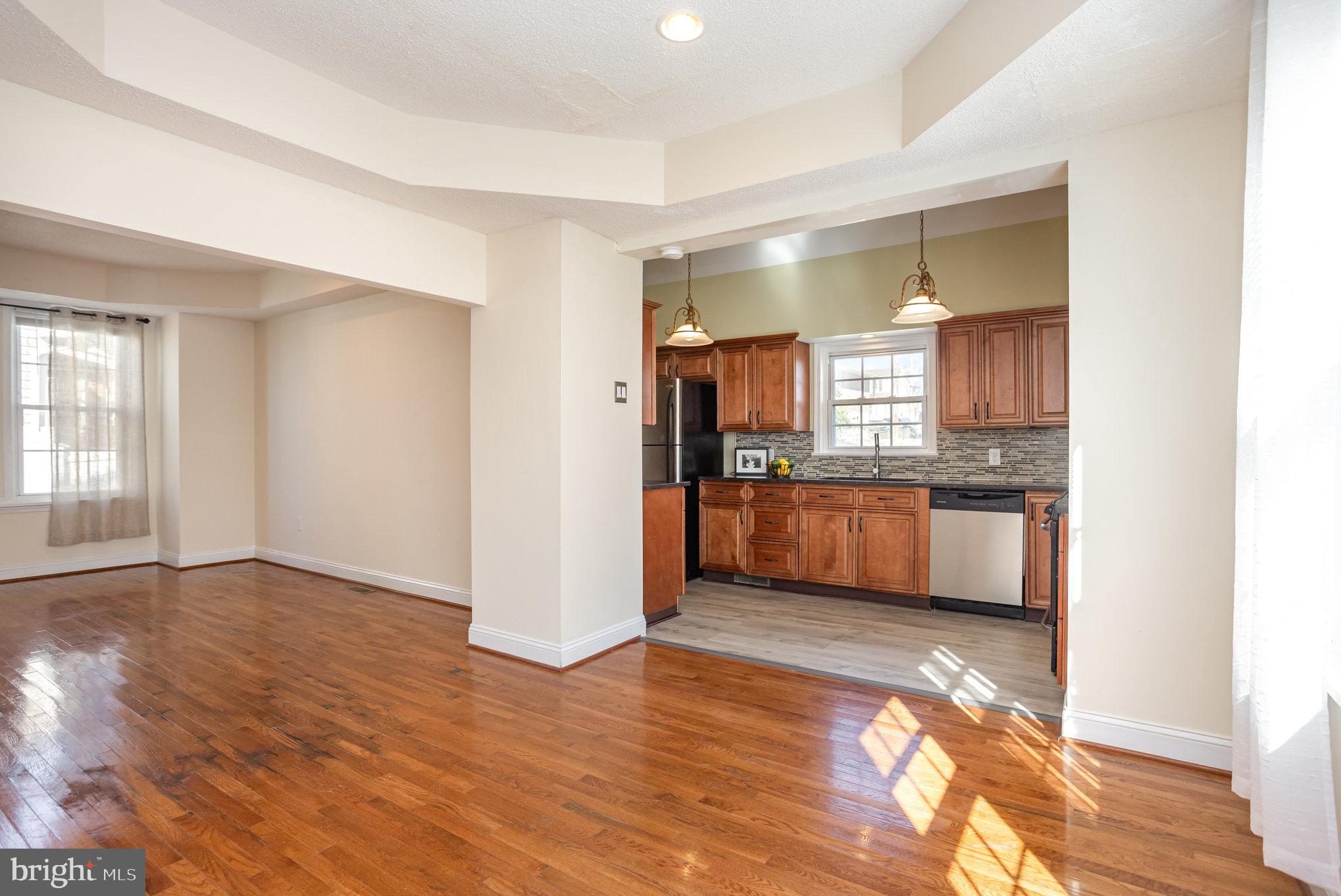 505 47th Street Baltimore, MD 21224 - Photo 16 of 41 a view of a kitchen cabinets and wooden floor