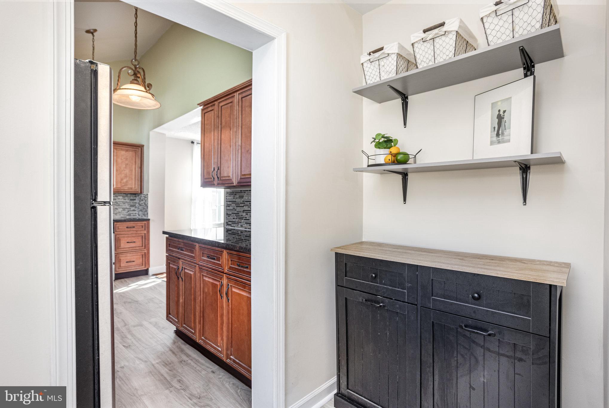 505 47th Street Baltimore, MD 21224 - Photo 23 of 41 a kitchen with a refrigerator and a cabinets