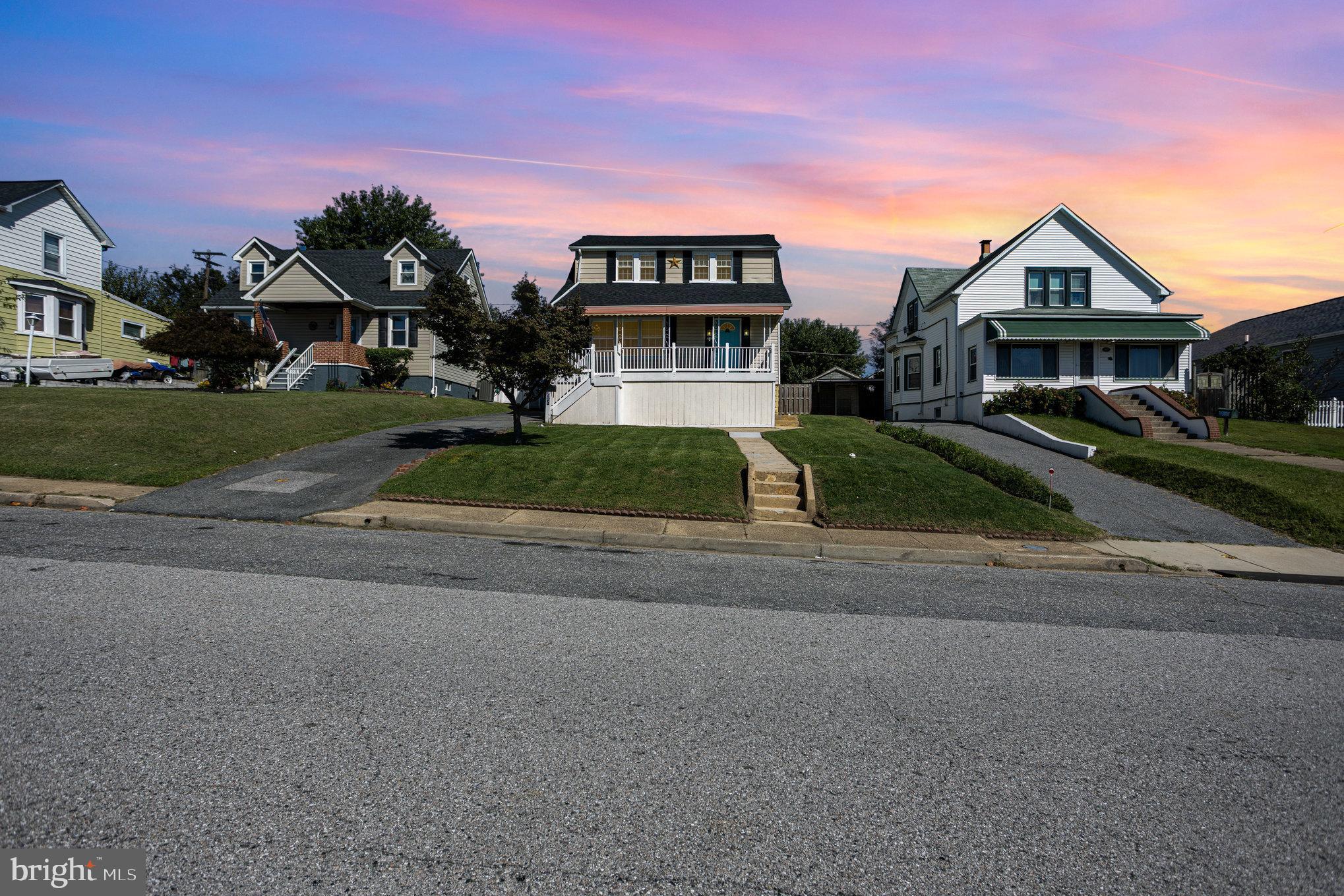 505 47th Street Baltimore, MD 21224 - Photo 3 of 41 a front view of a house with a yard