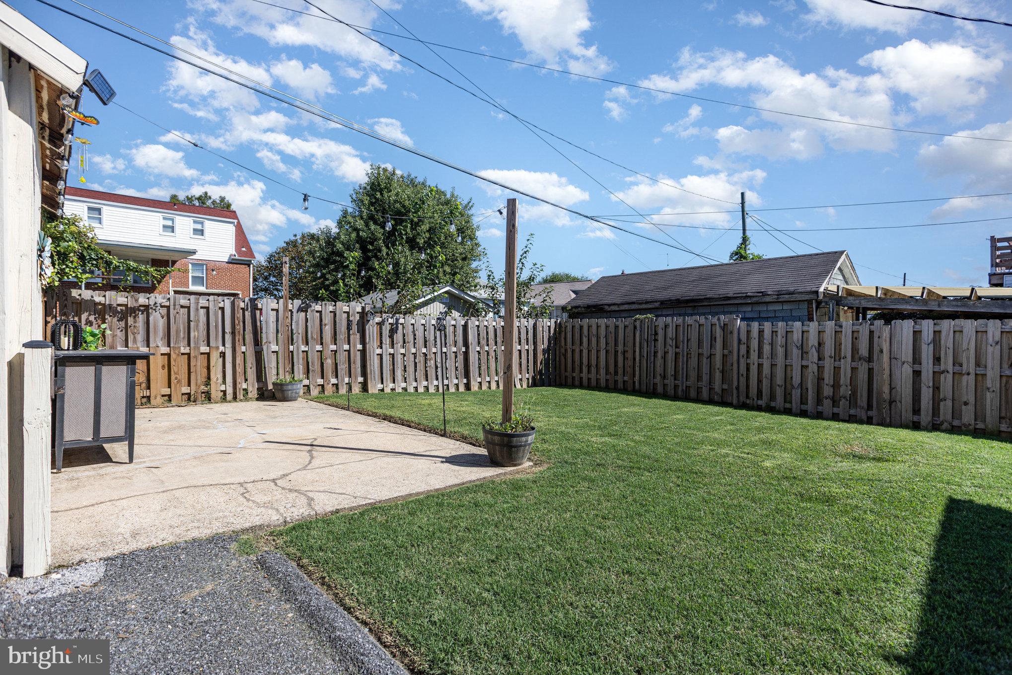 505 47th Street Baltimore, MD 21224 - Photo 35 of 41 a view of a backyard with a wooden fence