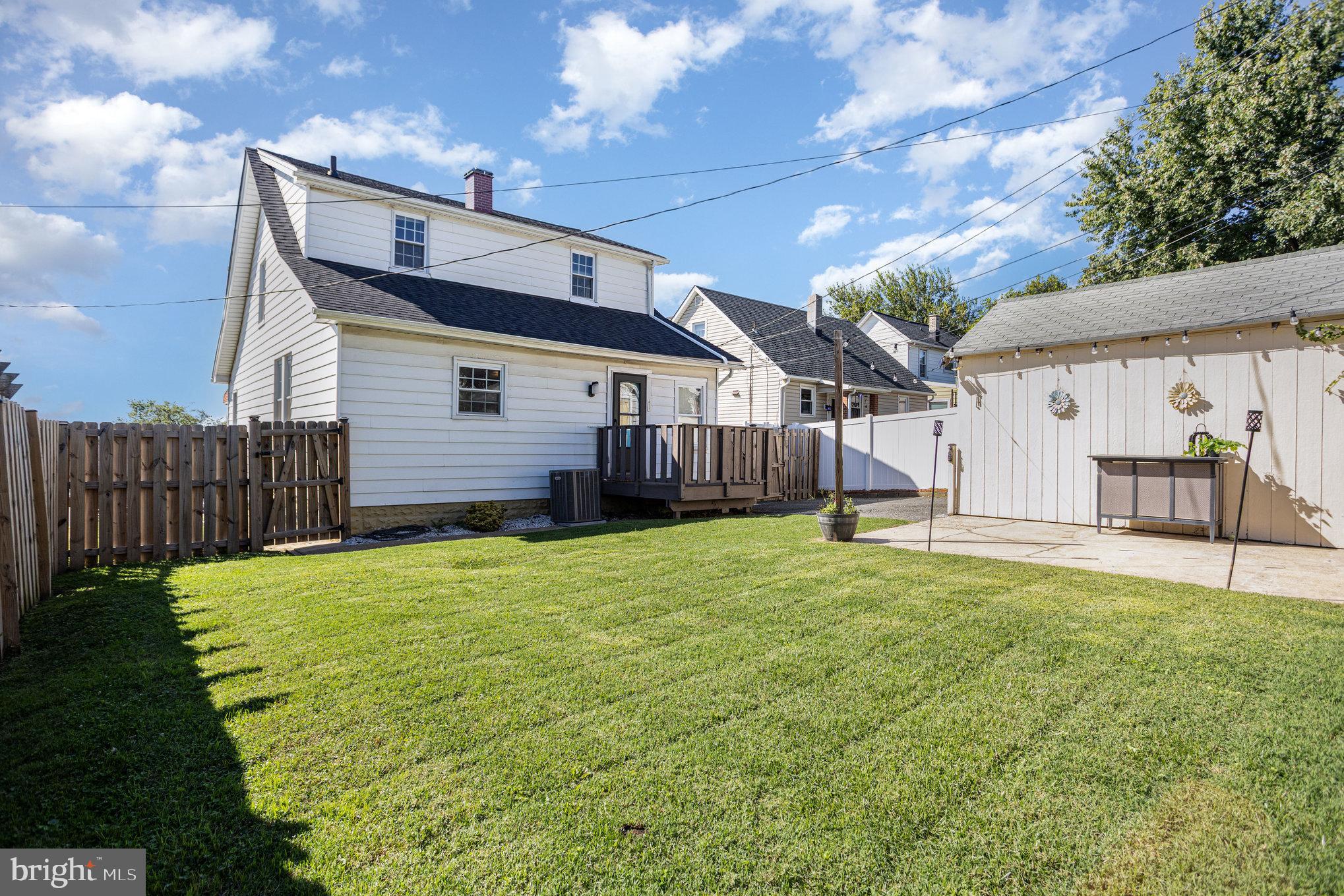 505 47th Street Baltimore, MD 21224 - Photo 37 of 41 a front view of a house with a yard and garage