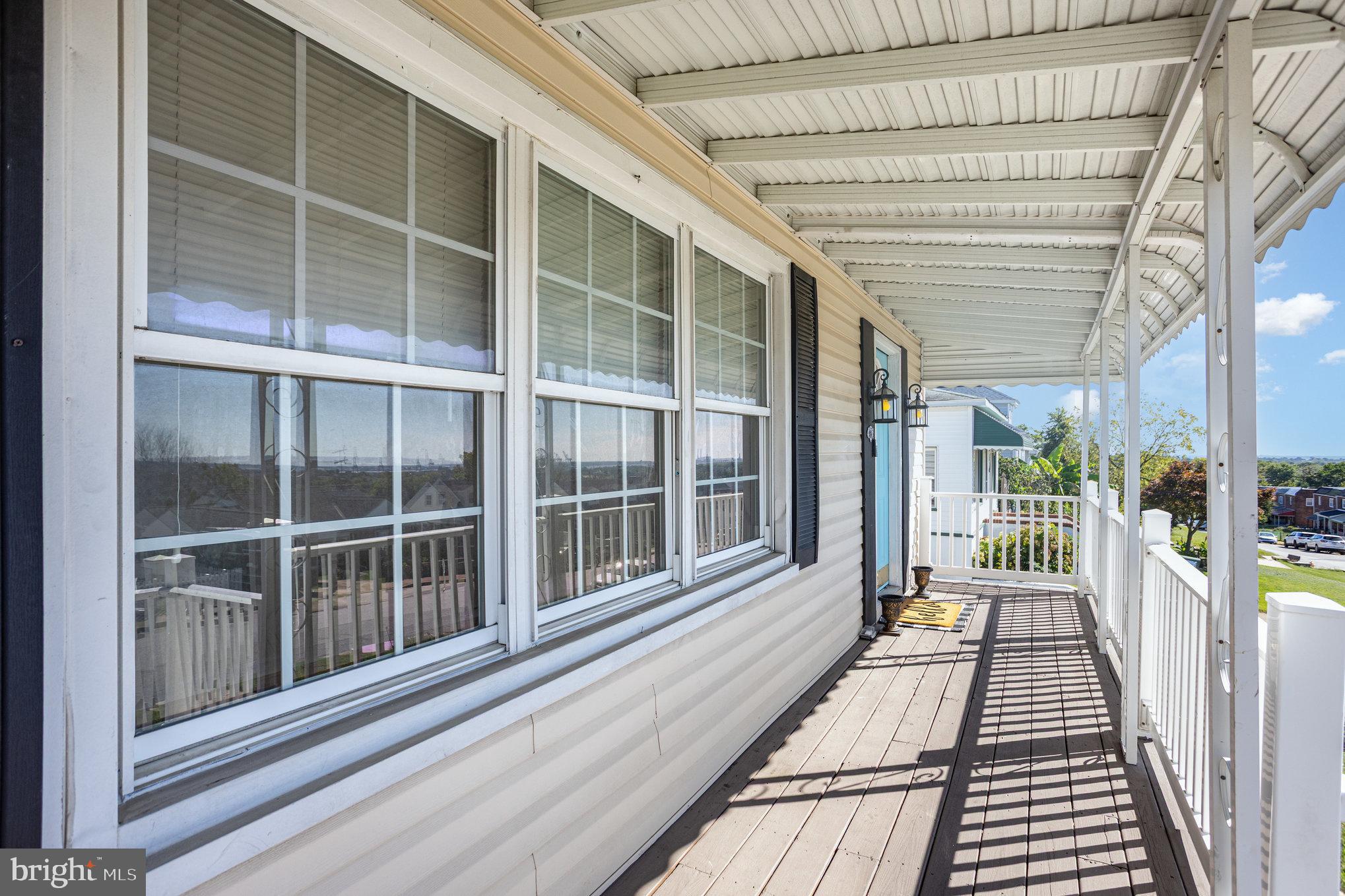 505 47th Street Baltimore, MD 21224 - Photo 4 of 41 a view of a balcony with wooden floor