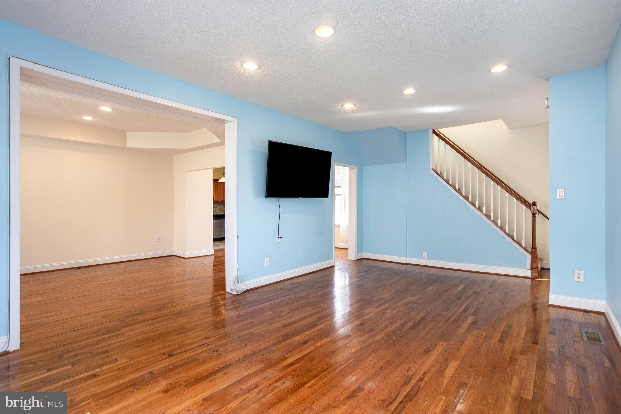 505 47th Street Baltimore, MD 21224 - Photo 8 of 41 a view of an empty room with wooden floor and a window