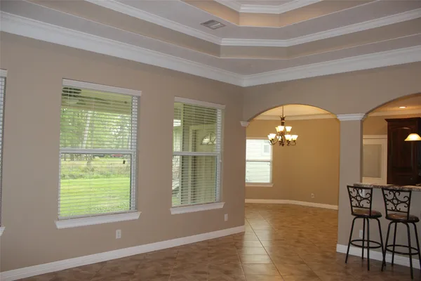 a kitchen with kitchen island granite countertop a sink and a stove