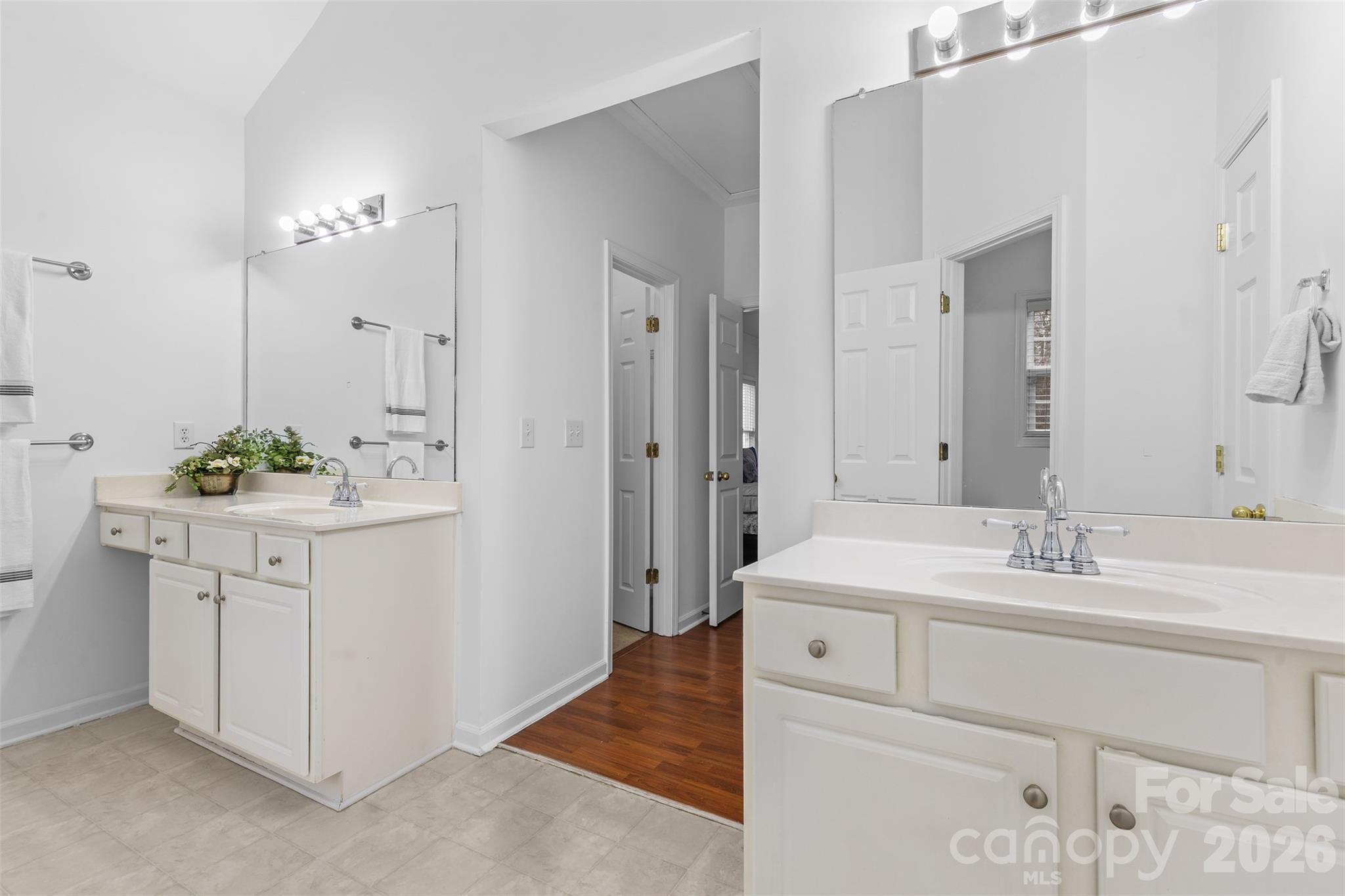 11919 Erwin Ridge Avenue Charlotte, NC 28213 - Photo 10 of 24 a spacious bathroom with a sink a mirror and a shower