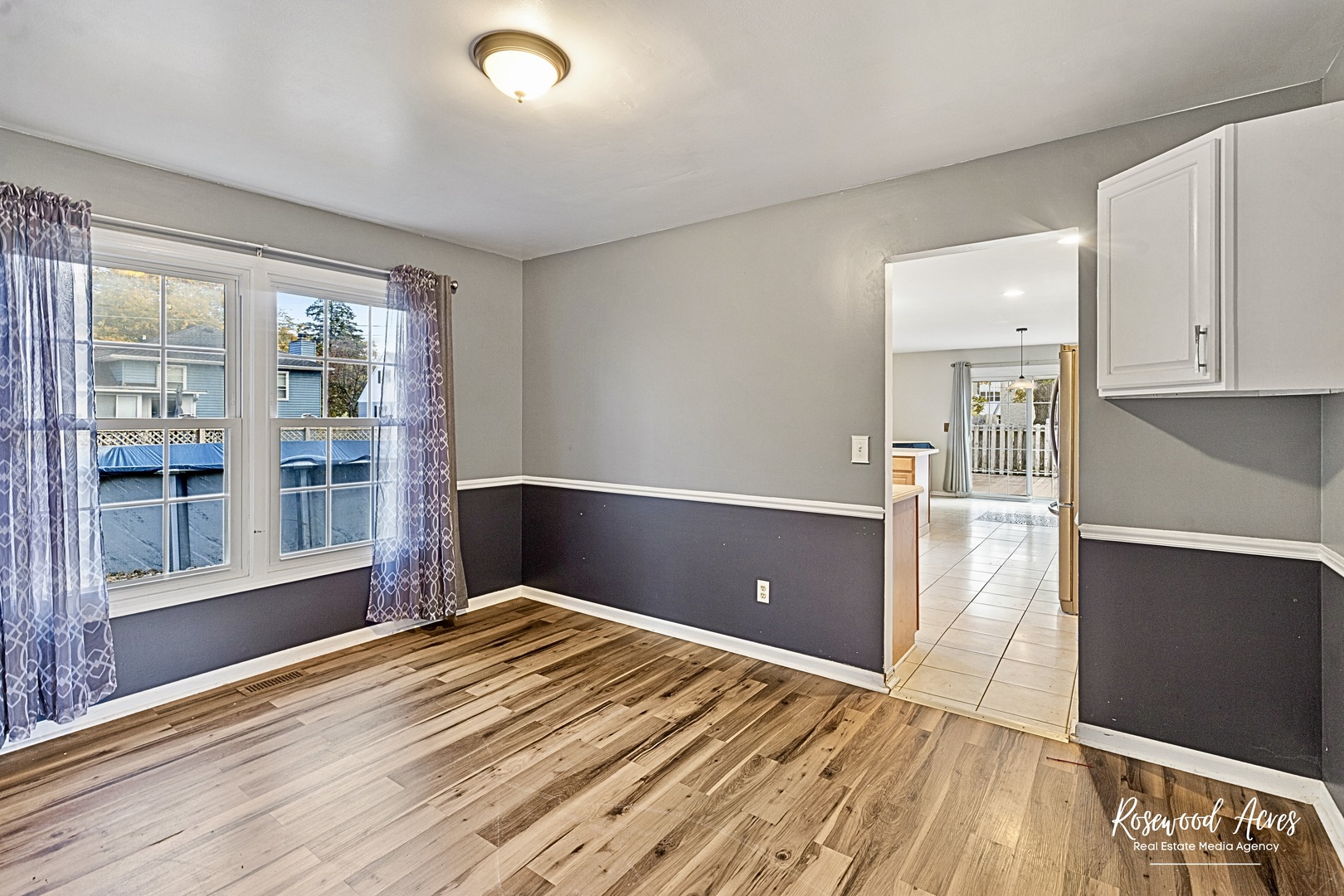 1403 West Budd Boulevard Kankakee, IL 60901 - Photo 18 of 46 a view of a room with wooden floor and windows