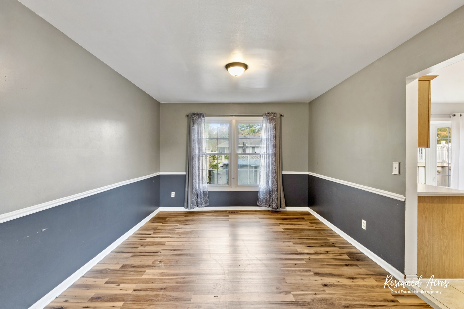 1403 West Budd Boulevard Kankakee, IL 60901 - Photo 21 of 46 a view of empty room with wooden floor and fan