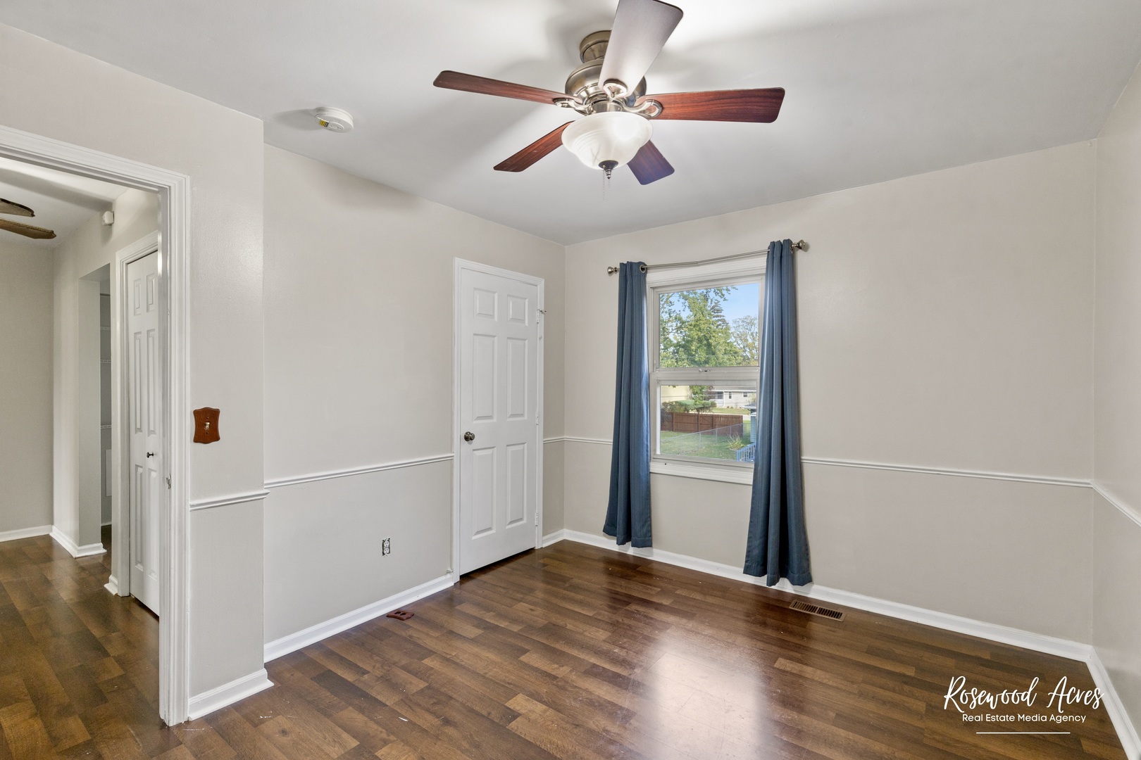 1403 West Budd Boulevard Kankakee, IL 60901 - Photo 25 of 46 wooden floor in an empty room with a window