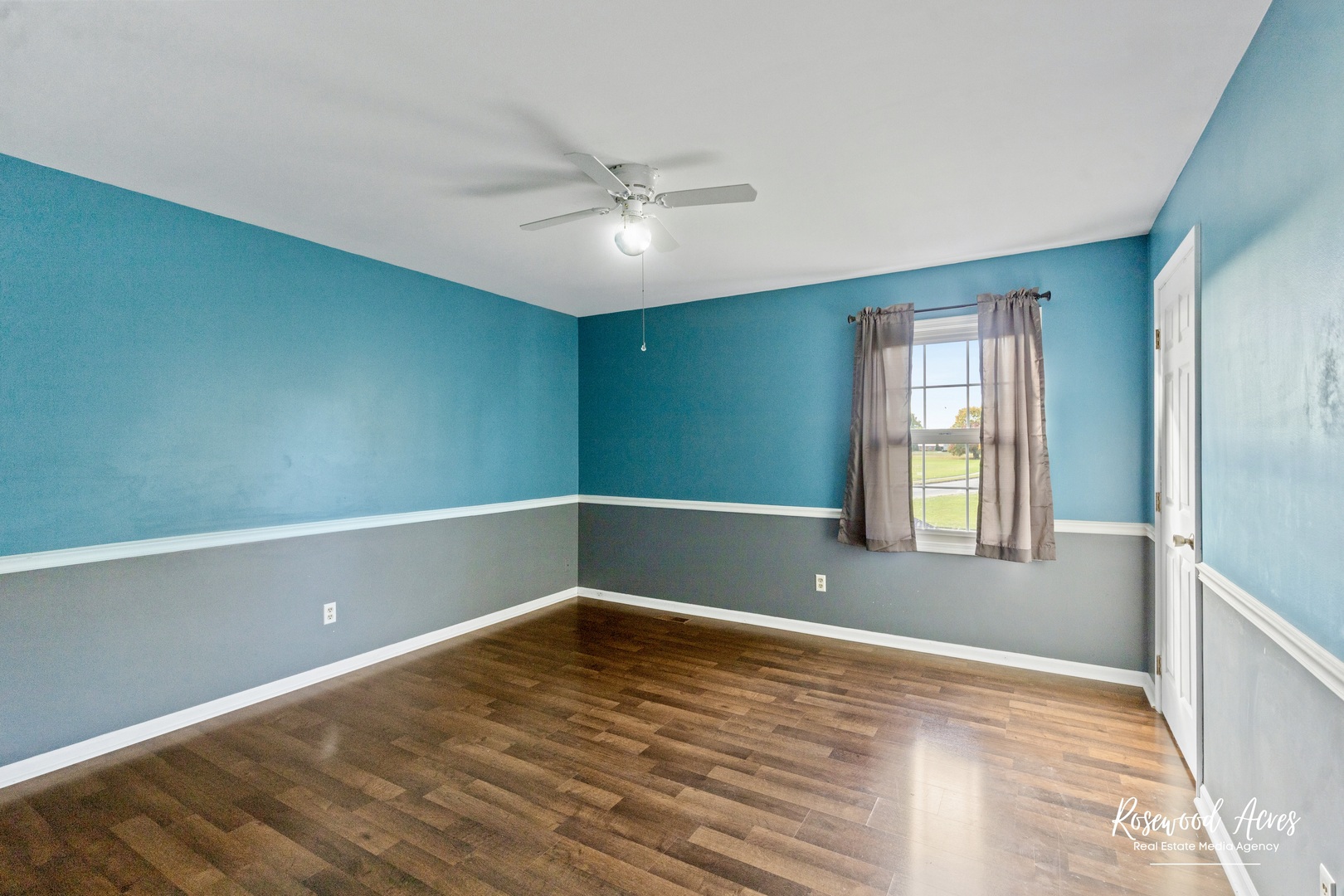 1403 West Budd Boulevard Kankakee, IL 60901 - Photo 28 of 46 a view of empty room with wooden floor and fan