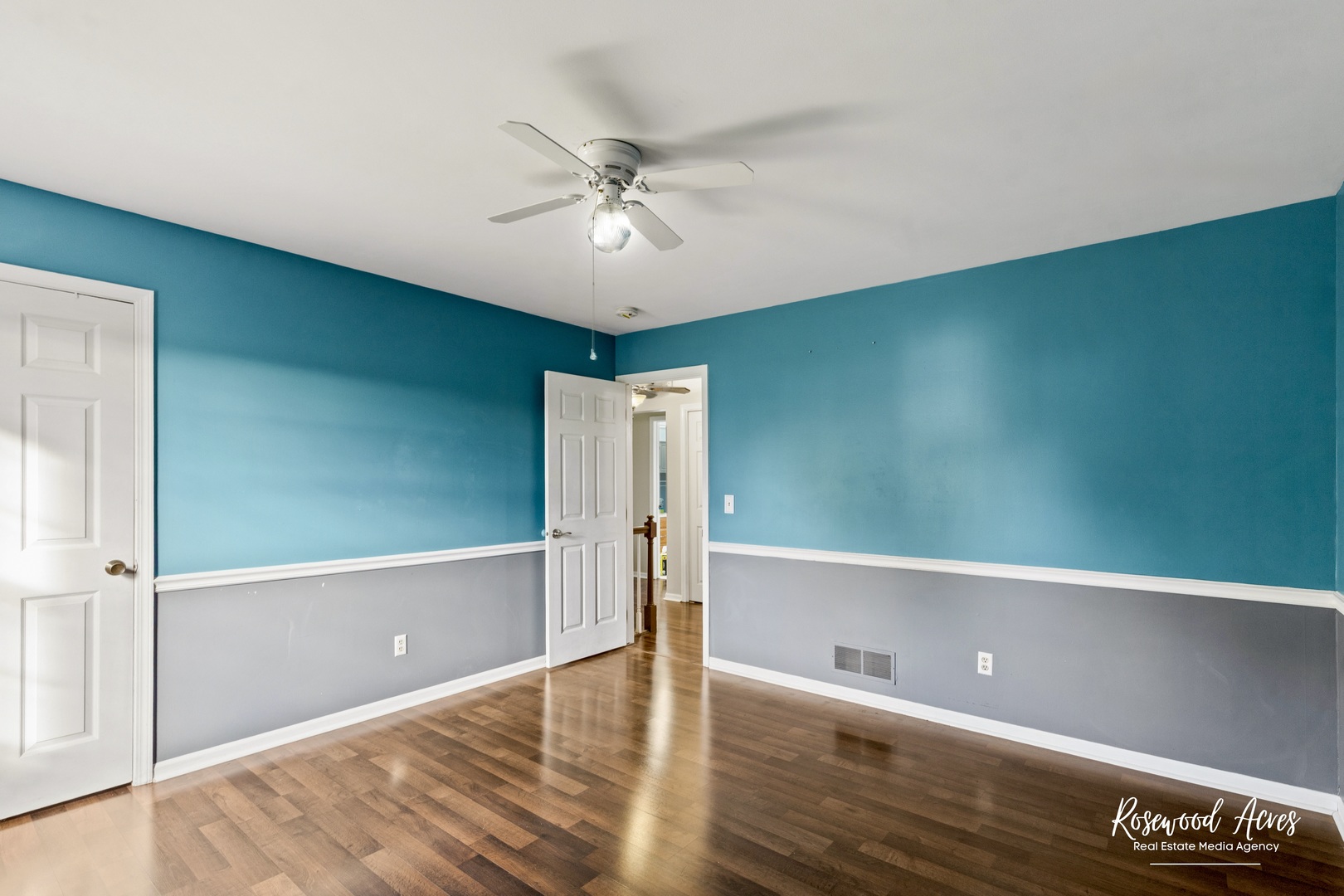 1403 West Budd Boulevard Kankakee, IL 60901 - Photo 30 of 46 a view of a room with a ceiling fan and wooden floor