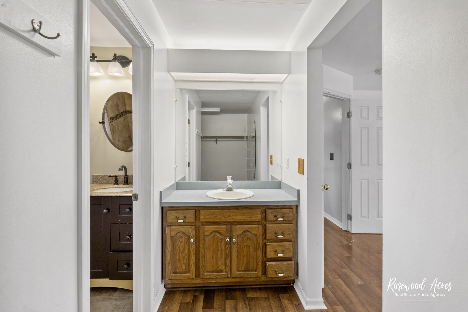 1403 West Budd Boulevard Kankakee, IL 60901 - Photo 37 of 46 a bathroom with a granite countertop sink a mirror and a shower