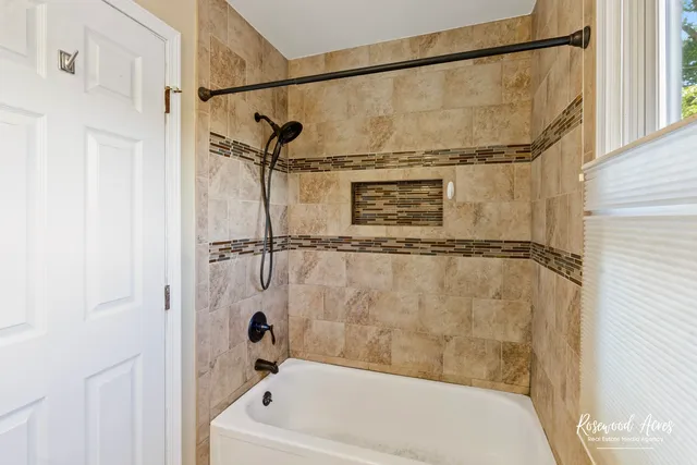 a bathroom with a sink mirror and toilet