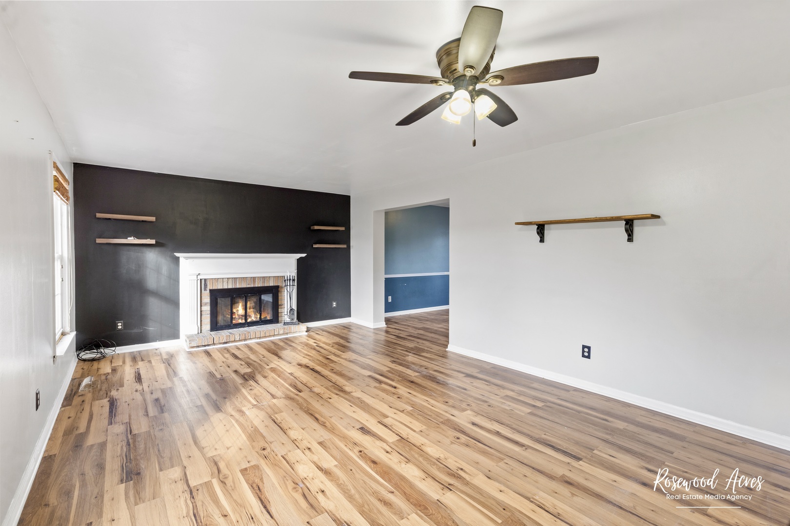 1403 West Budd Boulevard Kankakee, IL 60901 - Photo 4 of 46 a view of empty room with wooden floor and fan