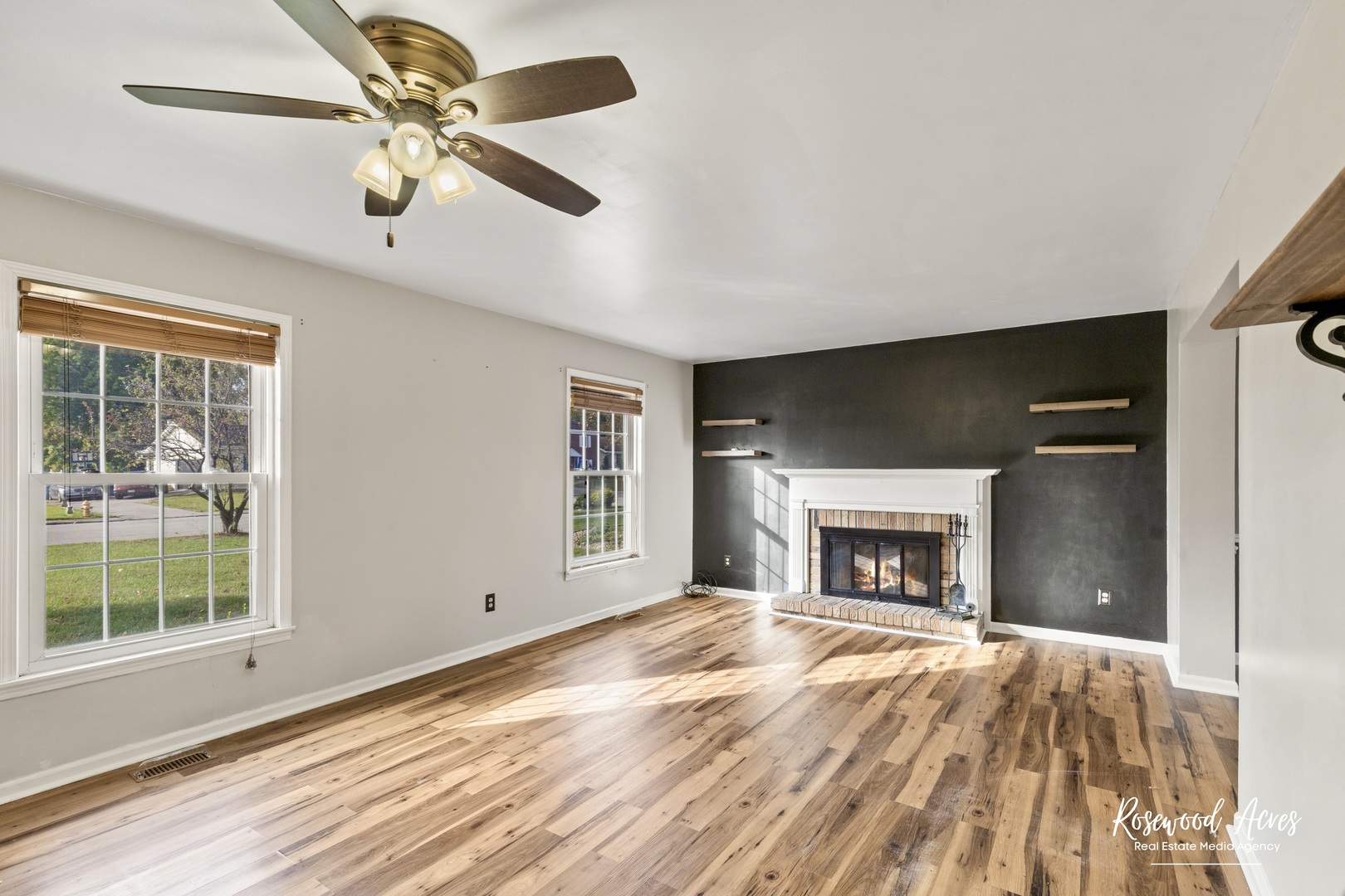 1403 West Budd Boulevard Kankakee, IL 60901 - Photo 7 of 46 a view of an empty room with window and fire place