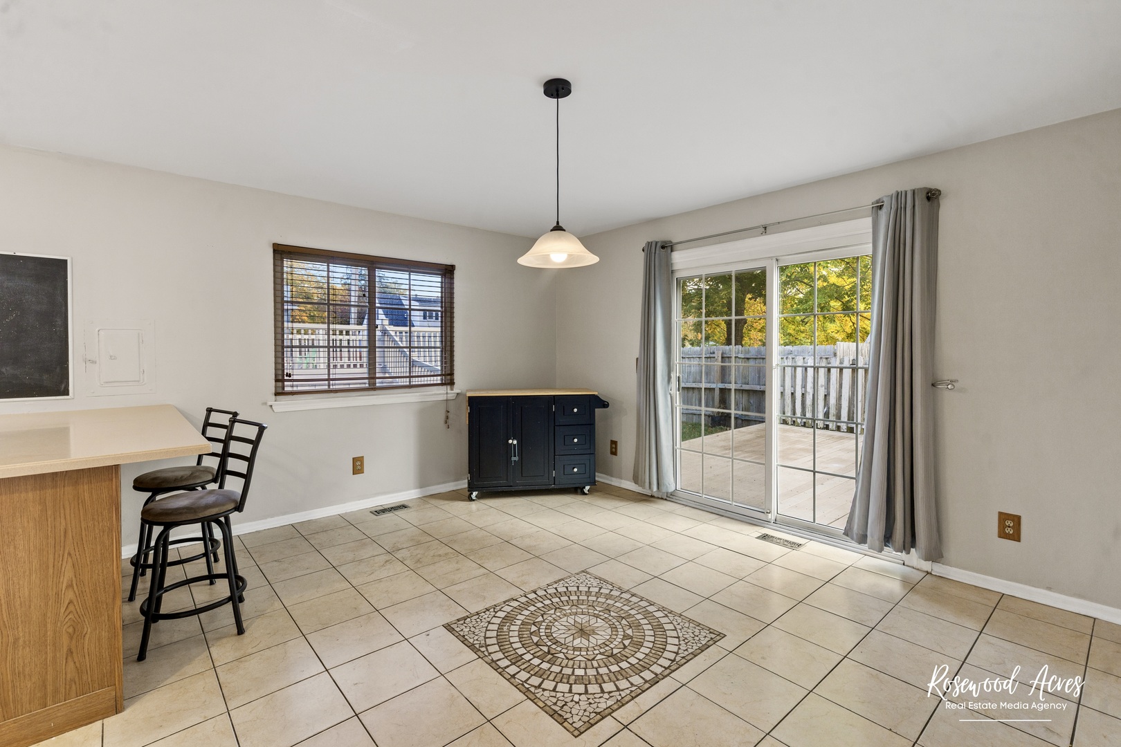 1403 West Budd Boulevard Kankakee, IL 60901 - Photo 9 of 46 a spacious bedroom with a bed and a table in it