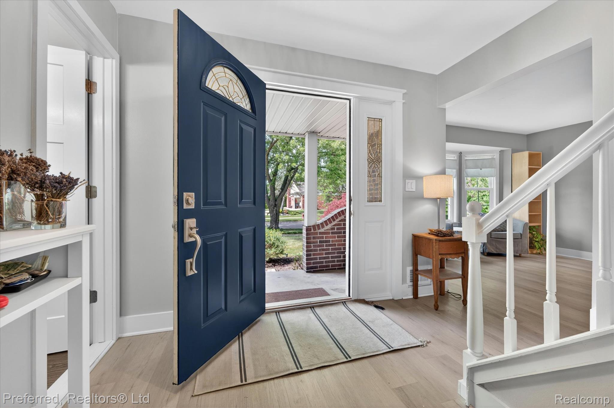 43751 Oakbrook Road Canton, MI 48187 - Photo 5 of 47 Welcoming entry paneled front door featuring an arched transom window and sidelights