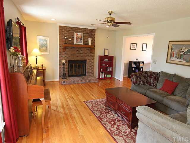 5402 Middleton Road Durham, NC 27713 - Photo 2 of 25 a living room with furniture and a fireplace