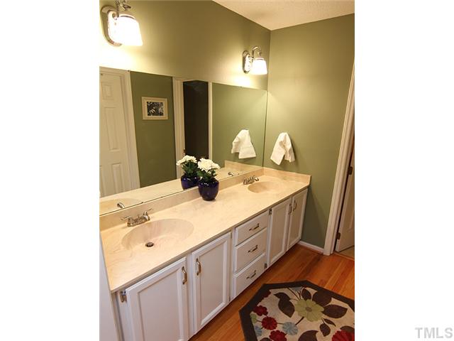 5402 Middleton Road Durham, NC 27713 - Photo 10 of 25 a bathroom with a sink and a mirror