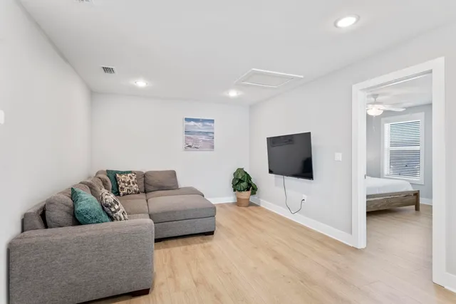 a bedroom with furniture and a window