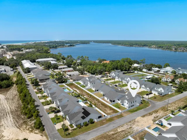 an aerial view of a city with ocean view