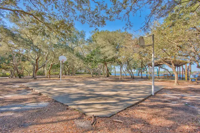 a front view of a building with a garden