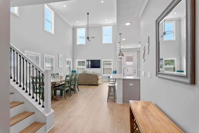 a large kitchen with cabinets table and chairs