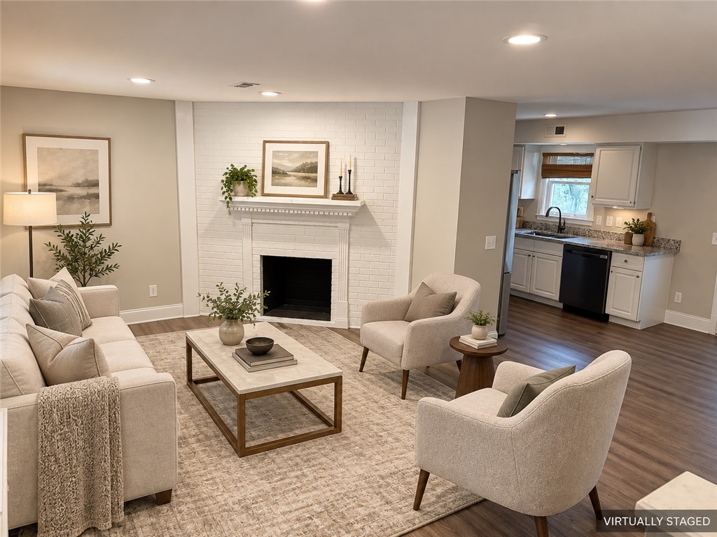 315 Rock Creek Road Clemson, SC 29631 - Photo 2 of 15 An inviting fireplace anchor has been integrated alongside smooth flooring in this open-concept layout.