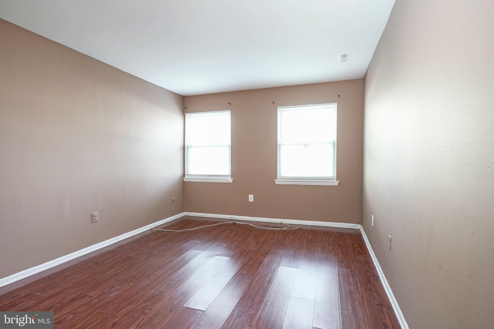133 Willow Turn Mount Laurel, NJ 08054 - Photo 17 of 24 an empty room with wooden floor and windows