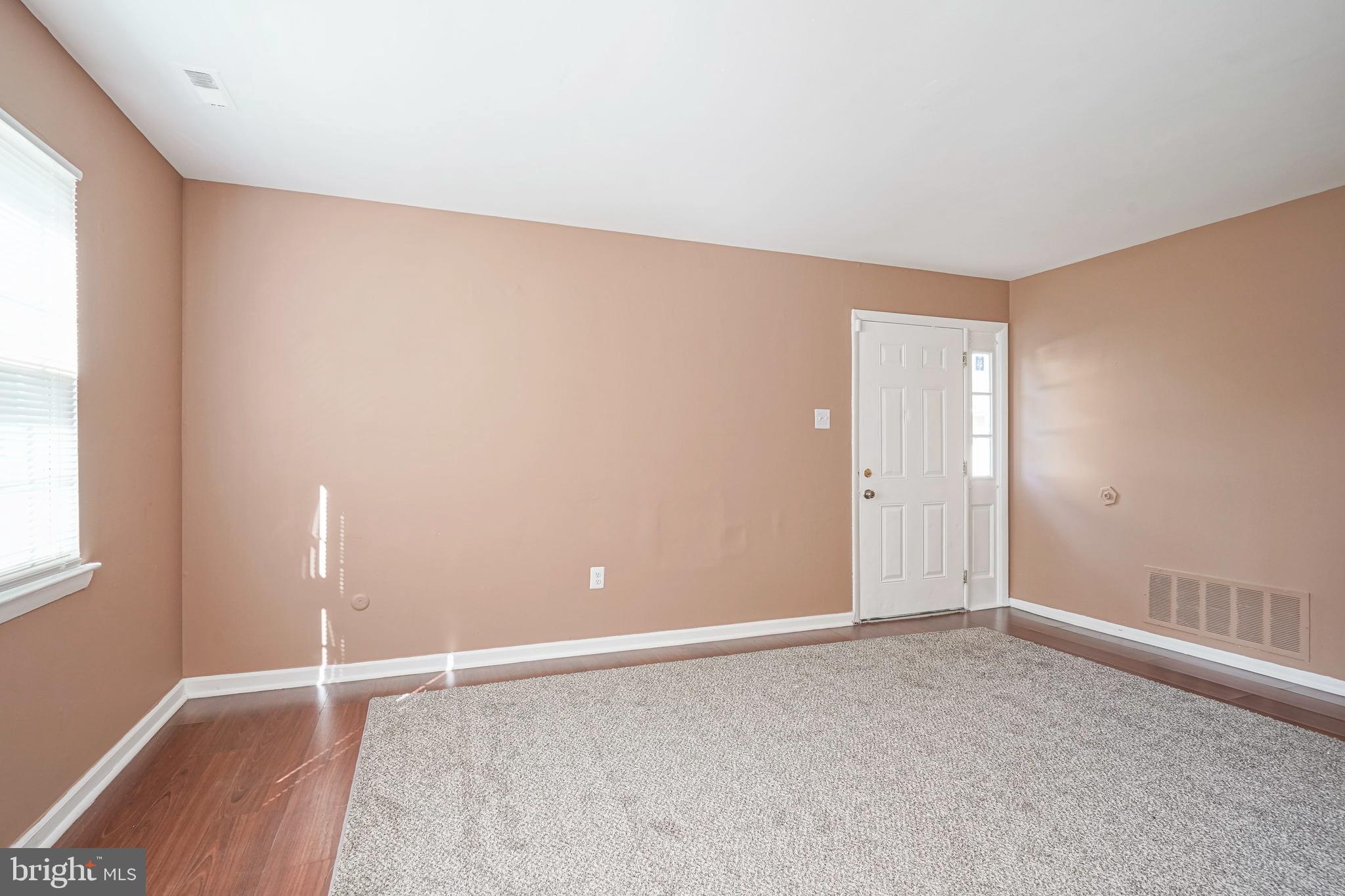 133 Willow Turn Mount Laurel, NJ 08054 - Photo 5 of 24 an empty room with wooden floor and windows
