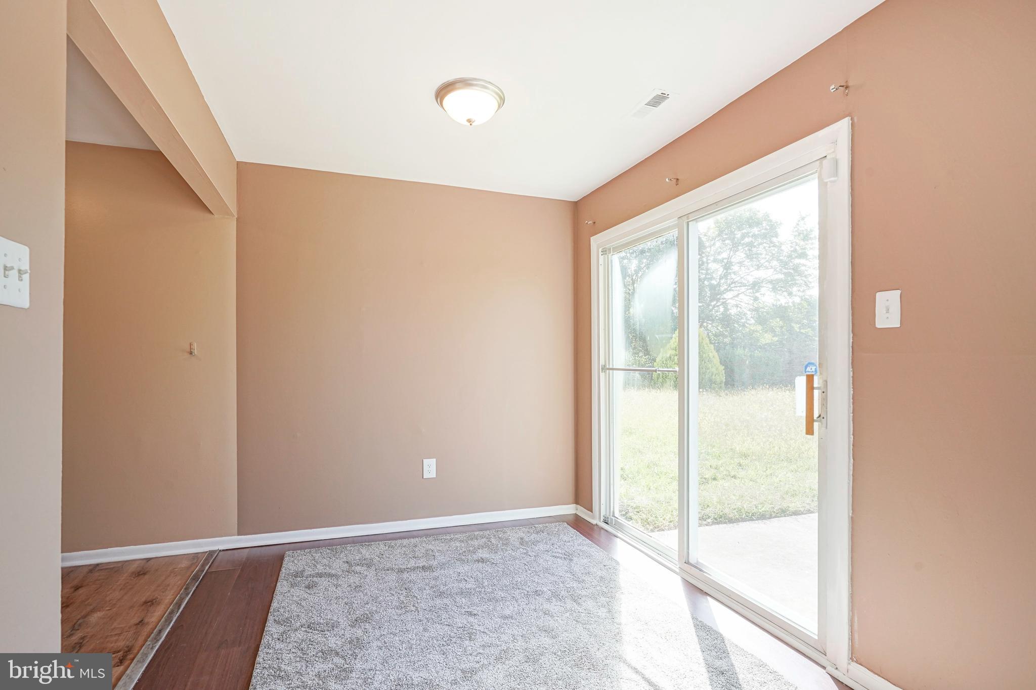 133 Willow Turn Mount Laurel, NJ 08054 - Photo 6 of 24 a view of an empty room with wooden floor and windows