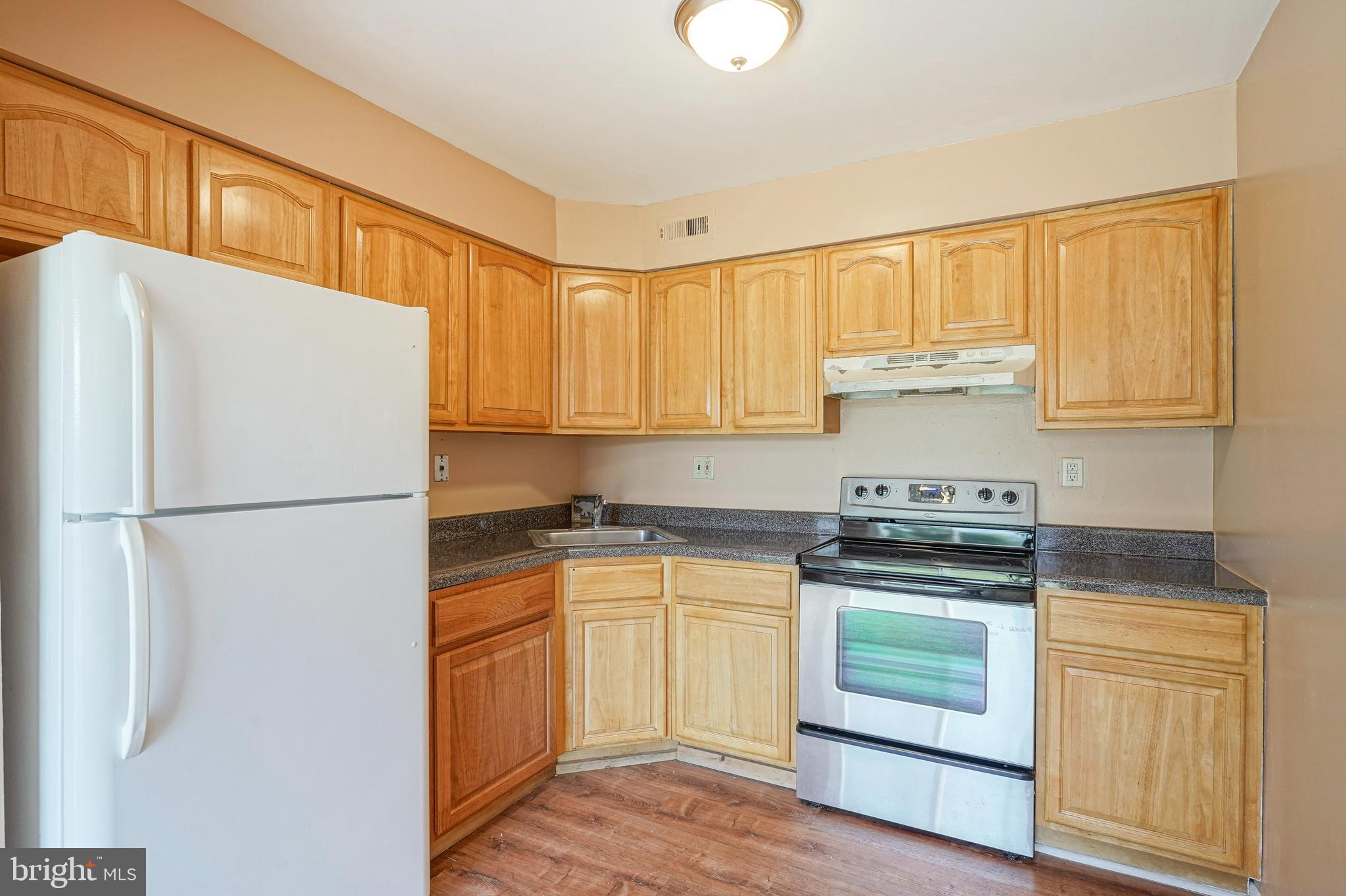 133 Willow Turn Mount Laurel, NJ 08054 - Photo 8 of 24 a white refrigerator freezer sitting inside of a kitchen