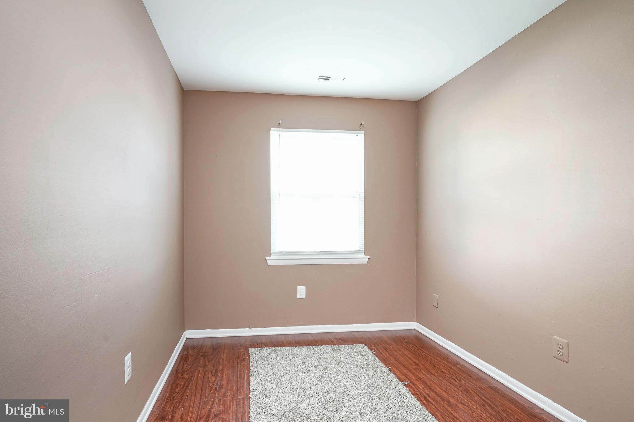 133 Willow Turn Mount Laurel, NJ 08054 - Photo 10 of 24 an empty room with wooden floor and windows