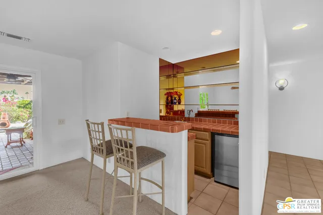 a kitchen with a table and chairs in it
