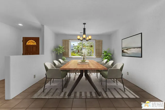 a view of a dining room with furniture and window