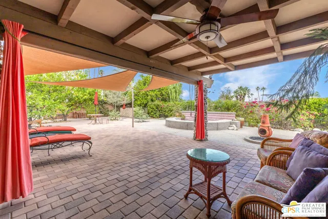 a outdoor space with patio the couches and pool table with chairs