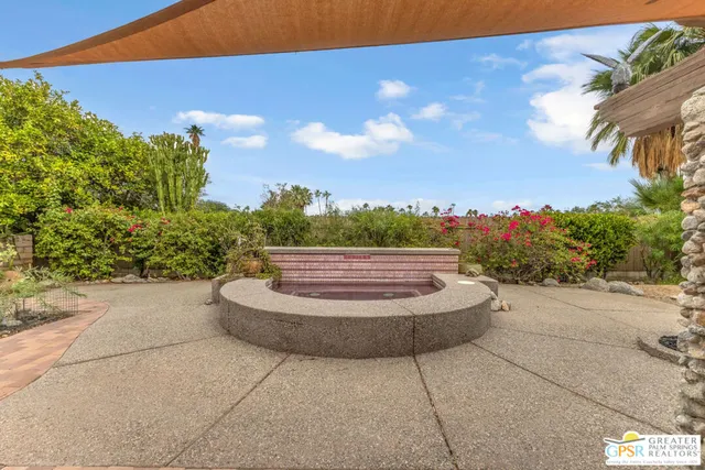 a swimming pool with an outdoor seating