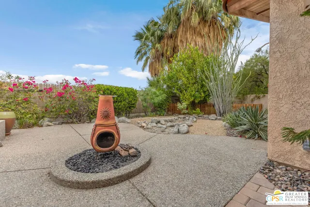 a table and chairs in a garden