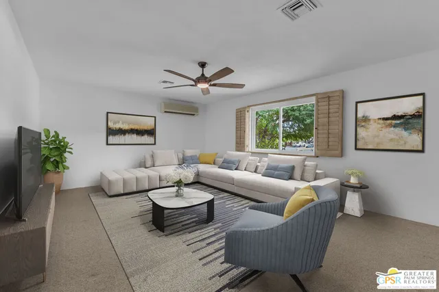 a living room with furniture and a large window