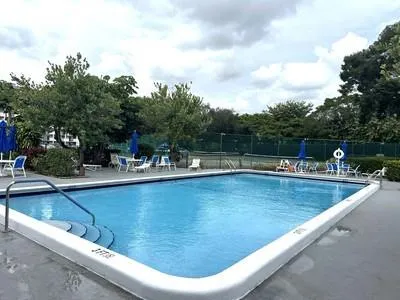 a view of swimming pool with outdoor seating